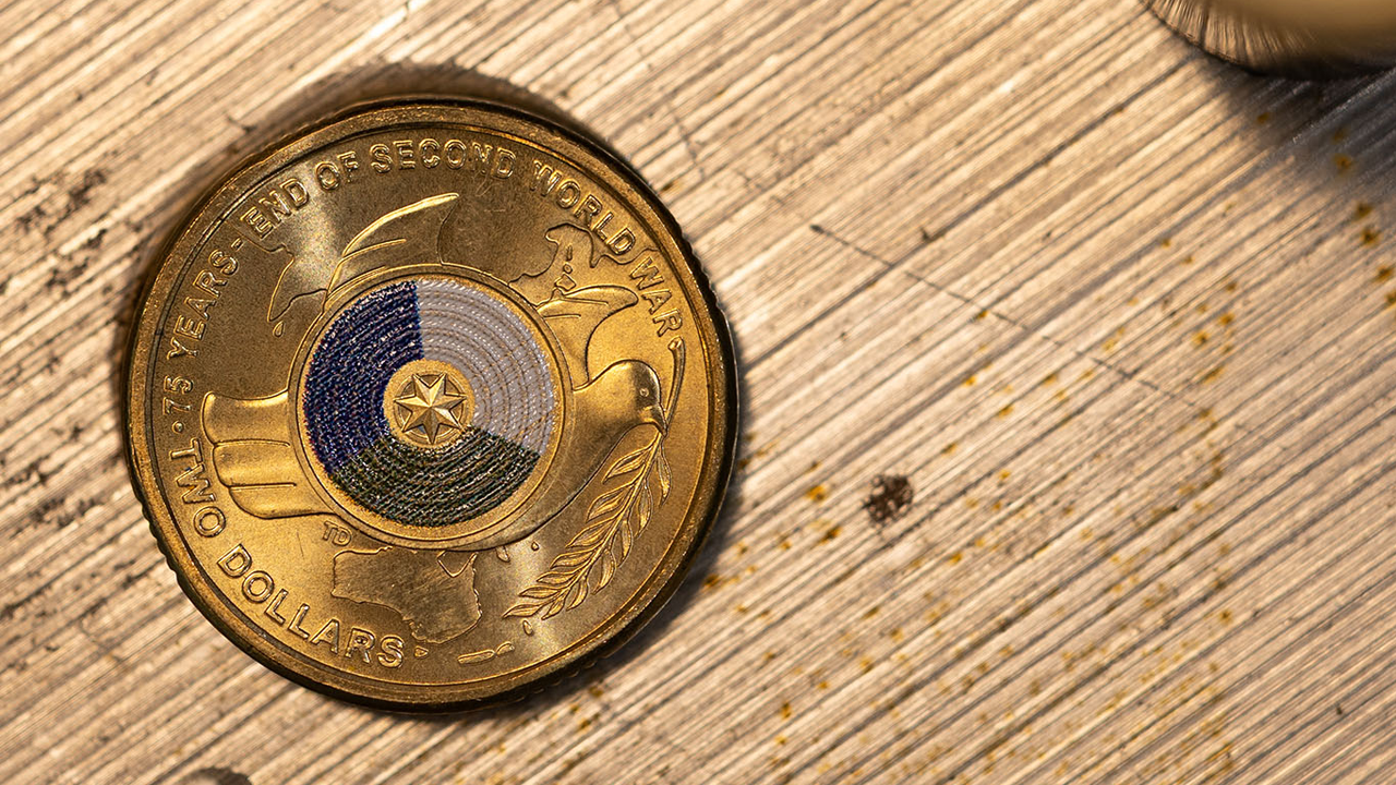 Two dollar coloured coin end of second world war.