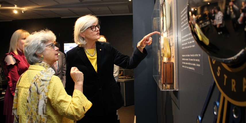 Public lecture wattle coin design people at gallery