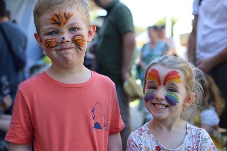 kids enjoying free face painting at the Royal Australian Mint Family Fun Day event