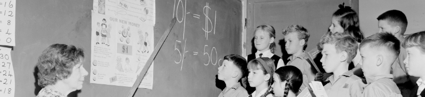 Children learning about decimal currency