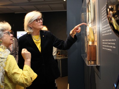 Public lecture wattle coin design people at gallery
