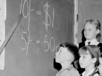 Children learning about decimal currency