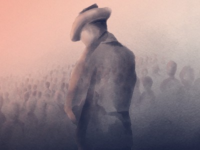 Dawn Service - soldier standing in a field of poppies