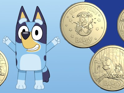 Five $2 Bluey uncirculated coins surrounding a cheering Bluey