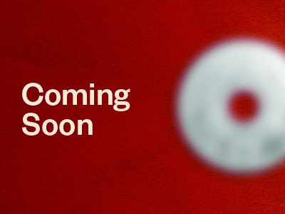 Blurred new coin against a red background with "Coming Soon" text.