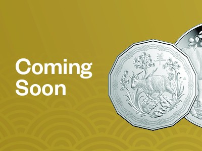 Two Year of the Goat coins against a gold background with text "Coming Soon".