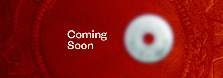 Blurred new coin against a red background with "Coming Soon" text.