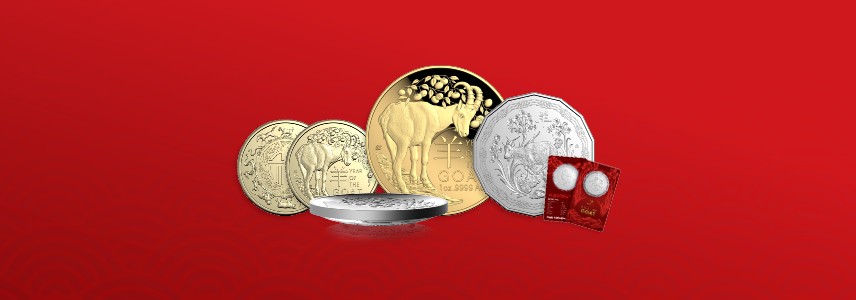 Four Lunar Year of the Goat coins against a red background.
